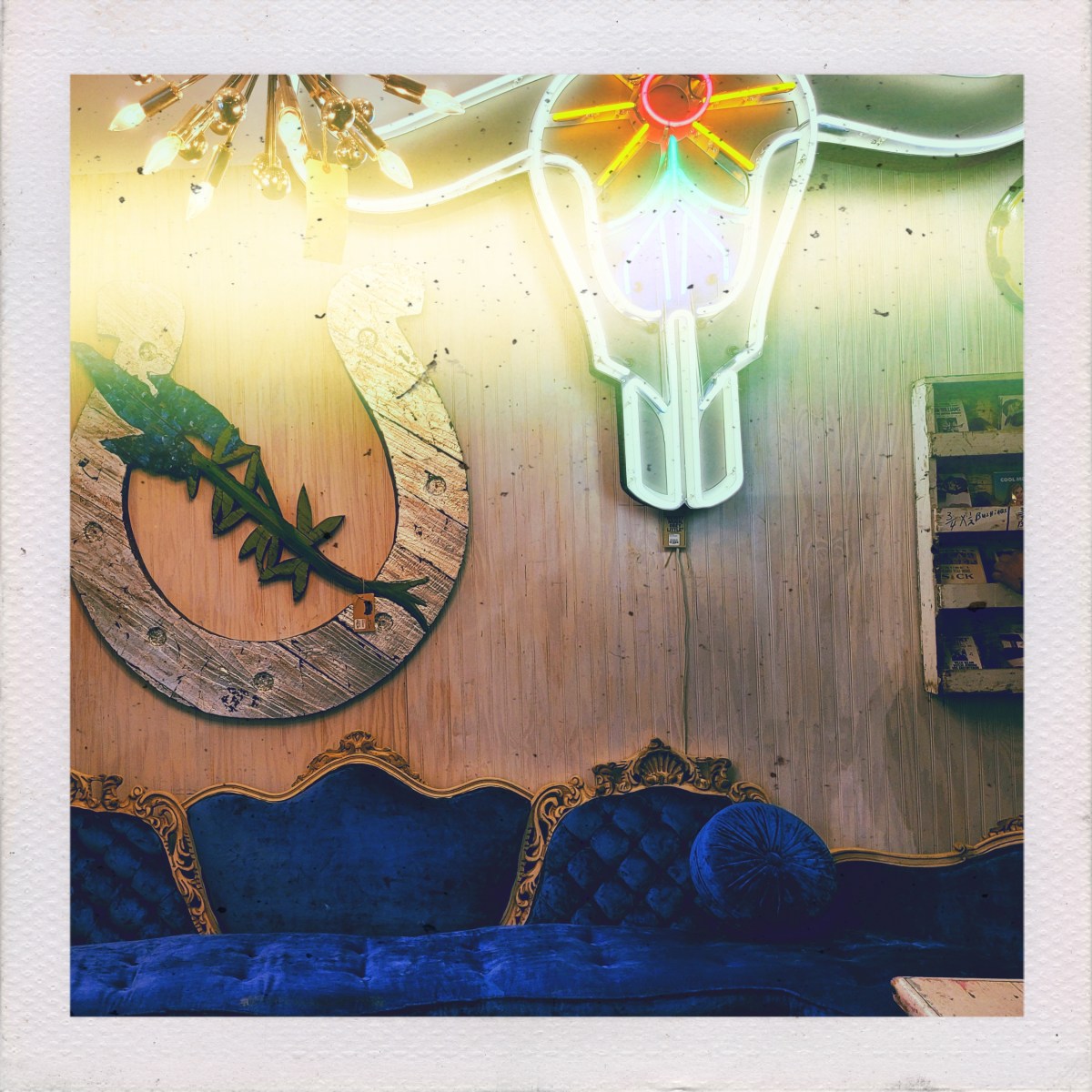 Laughing on an old brown leather&nbsp;couch.